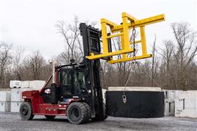 Rahns Concrete: A forklift moves a large precast concrete structure into the storage yard.