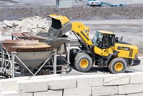 Rahns Concrete: A Komatsu WA320 loader fills a hopper with sand at a ready-mix plant.