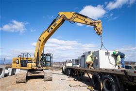 Rahns Concrete: A Rahns Concrete truck makes a delivery to a job site.